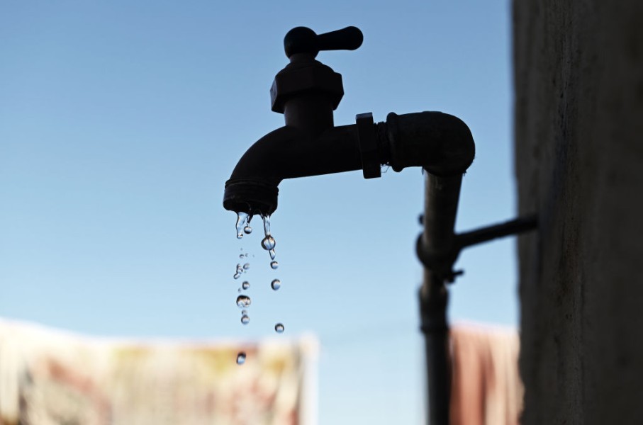 File: Water dripping from a tap.  Leon Sadiki/Bloomberg via Getty Images