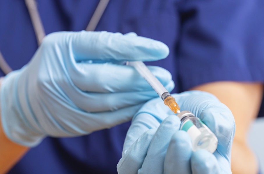 File: A healthcare worker fills a syringe with a vaccine. GettyImages/Andril Zorii