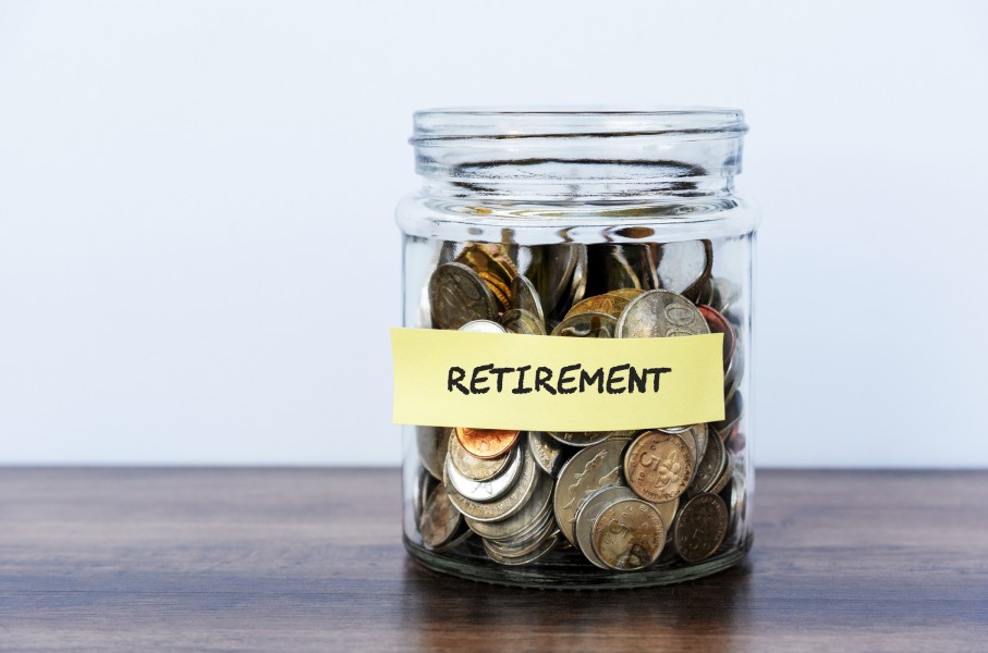 A bottle filled with coins for retirement. GettyImages/Nora Carol Photography