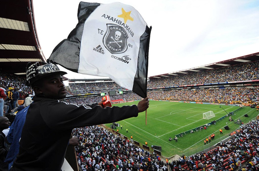 File: A fan waving an Orlando Pirates flag. Lefty Shivambu/Gallo Images/Getty Images