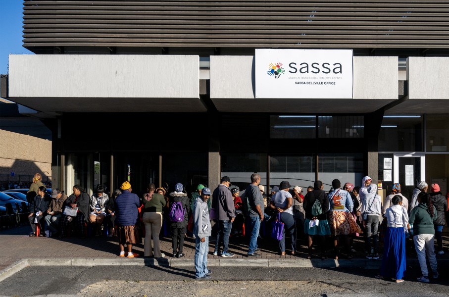 People queue outside the SASSA office to exchange SASSA cards for the new Postbank Black Cards. Gallo Images/Die Burger/Jaco Marais