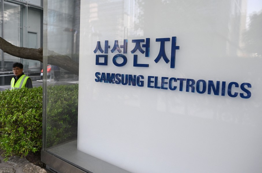 A man walks past the logo of Samsung Electronics displayed outside the company's Seocho building in Seoul. AFP/Jung Yeon-je