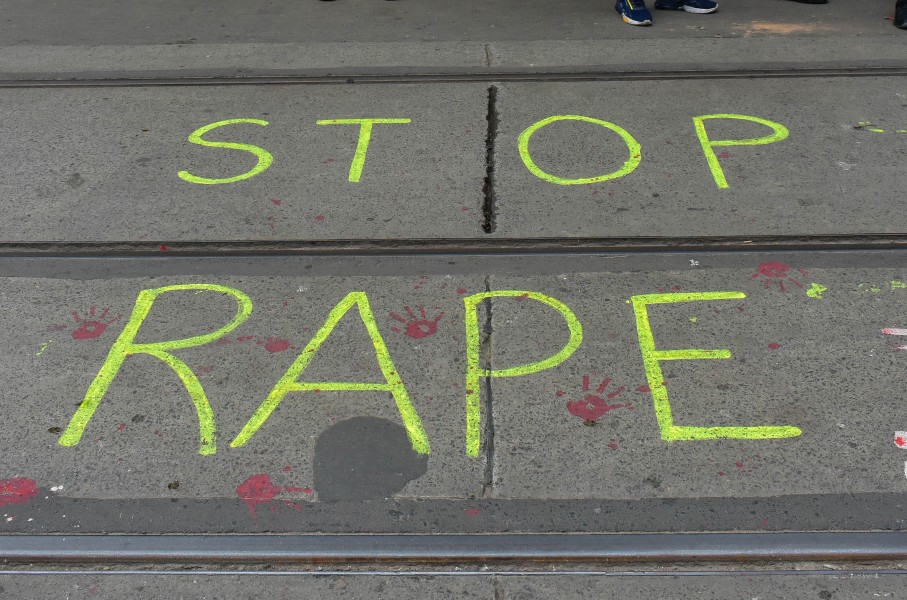 ''Stop rape'' is written on the road by protesters. Debarchan Chatterjee/NurPhoto via AFP