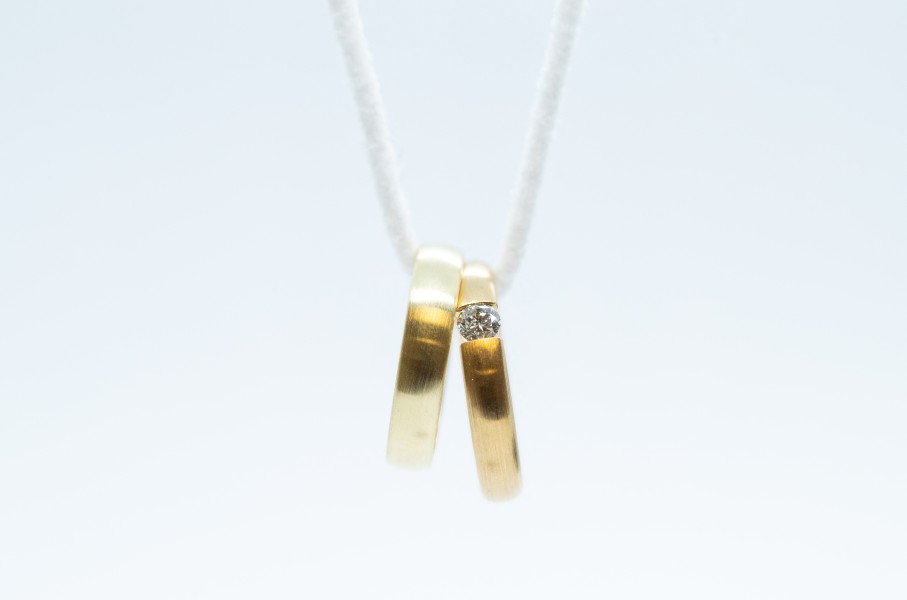 File: Wedding rings on a chain. Friso Gentsch/dpa via AFP