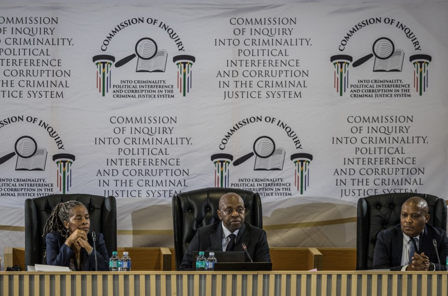 Justice Mbuyiseni Madlanga delivers his remarks during the judicial commission of inquiry probing Provincial Police Commissioner Nhlanhla Mkhwanazi's claims. AFP/Phill Magakoe