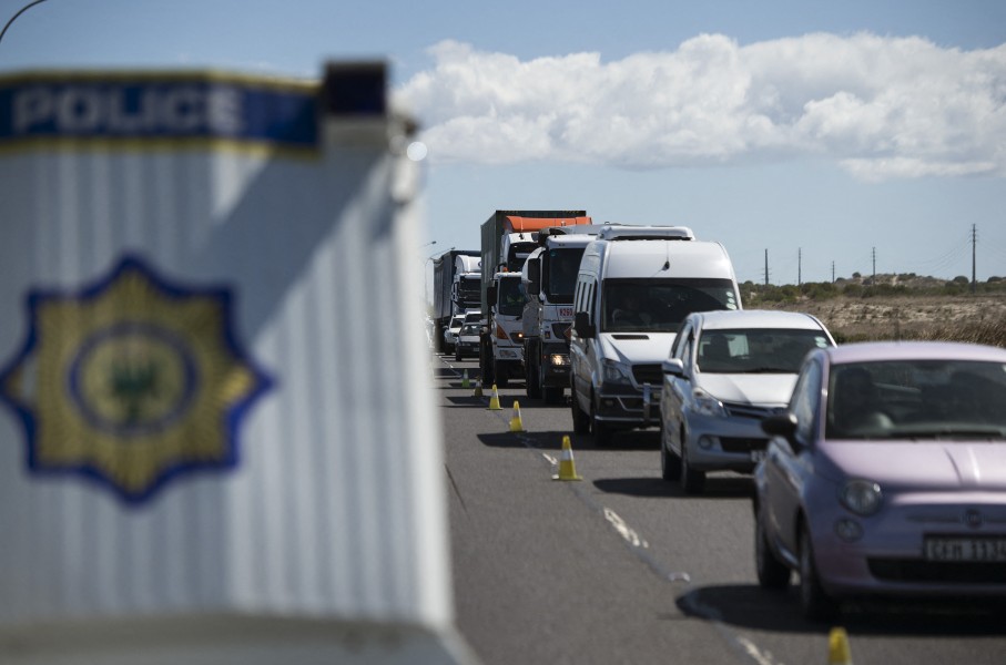 SAPS officers and traffic officials conduct a roadblock on a national highway. AFP/Rodger Bosch