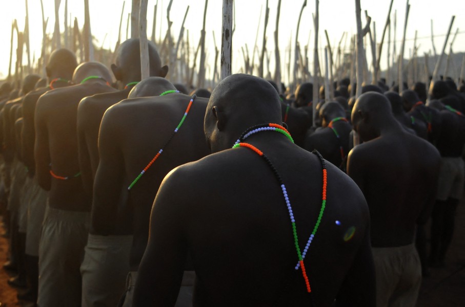 Initiates gather in a group as they return home. AFP/Lucas Ledwaba