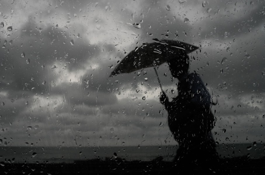 File: A man with an umbrella walking in the rain. Thilina Kaluthotage/NurPhoto via AFP