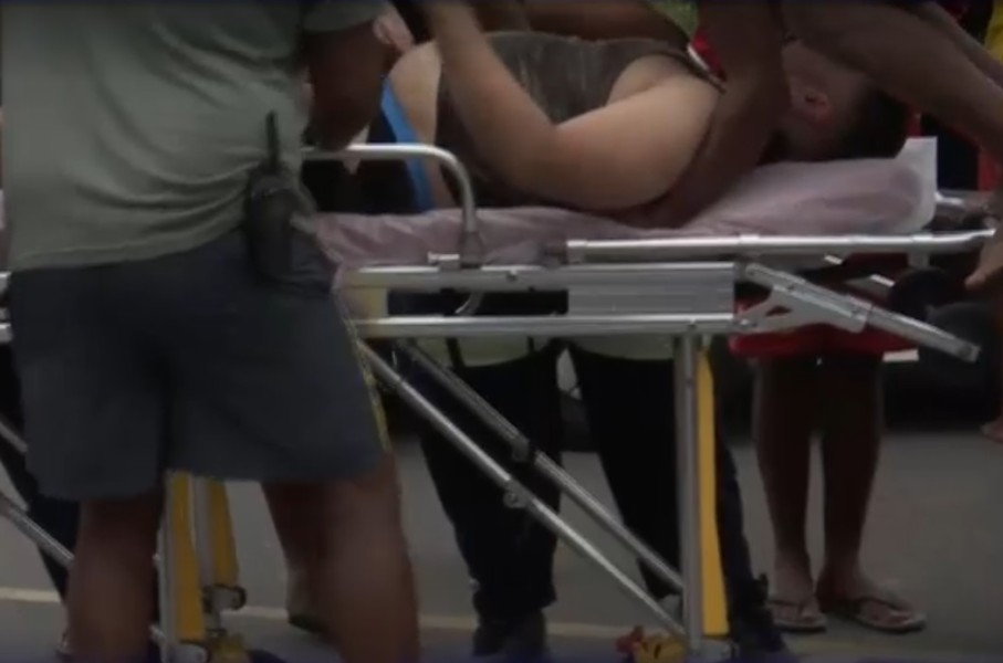 Image of male being rescued from a near-drowning experience at Baggies Beach in Durban.