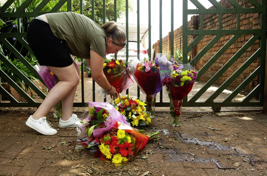 mbers of the public lay flowers in front of the gate after the murder of Marius van der Merwe. Gallo Images/Rapport/Elizabeth Sejake