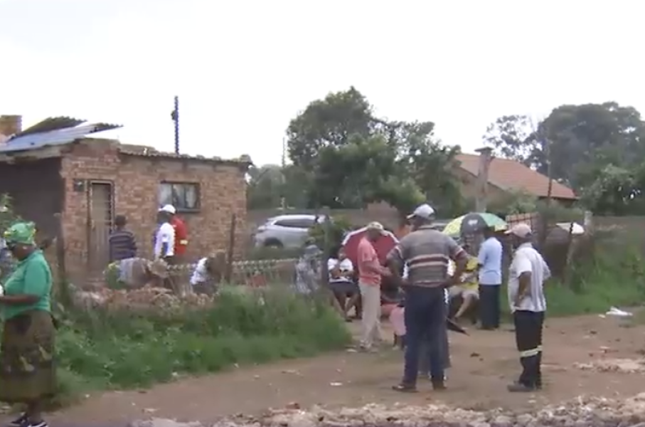 Family members at the collapsed building.