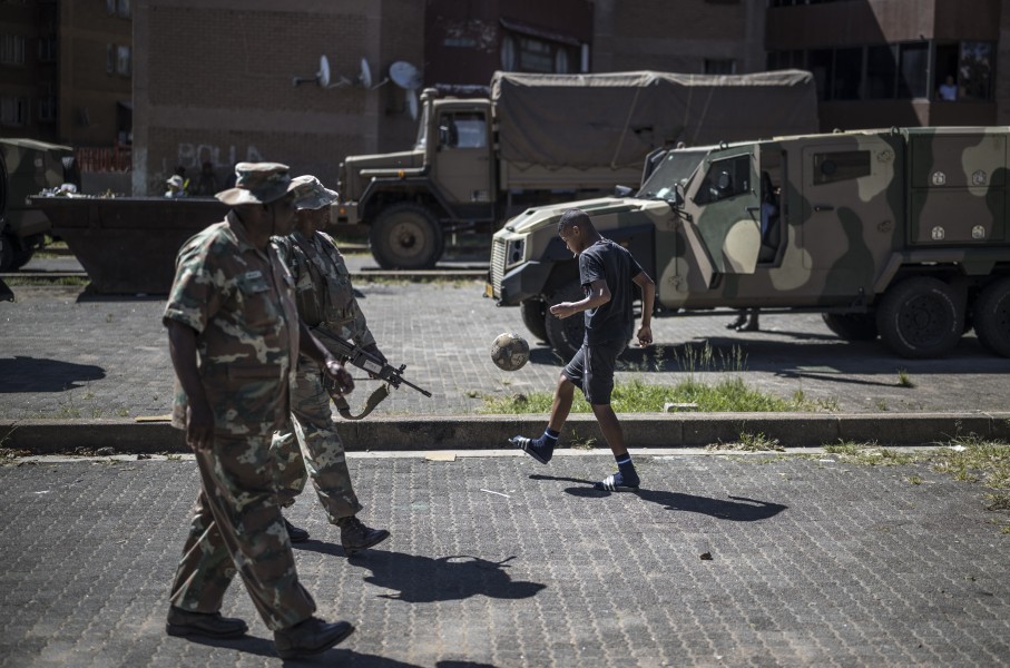  soldiers patrol a residential complex in Westbury, Johannesburg. AFP/Marco Longari