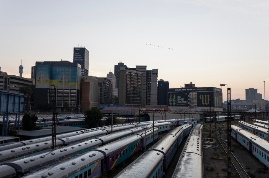 A general view of Shosholoza Meyl train carriages with the skyline of Braamfontein, Johannesburg, in the background on March 28, 2026. (Photo by Wikus de Wet / AFP)