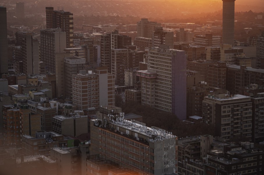A general view of high-rise buildings of the Johannesburg skyline from the 51th floor of Ponte City, also known as Ponte Tower, in Berea, Johannesburg on May 24, 2024. (Photo by Michele Spatari / AFP)