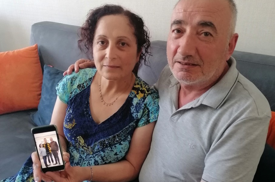 Kerban Kalin and Ali Kalin show a photograph of their son Cadet Officer Alper Kalin who has been serving a life sentence following the last coup in Turkey.