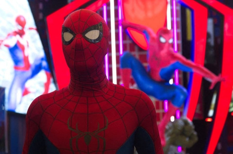 A man dressed as Spider-Man poses in front of a Marvel Studios Spider-Man booth. Ying Tang/NurPhoto via AFP