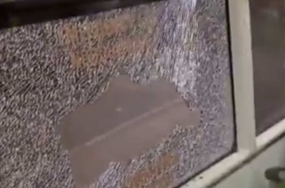 Another video shows a bus with a smashed window. Screenshot