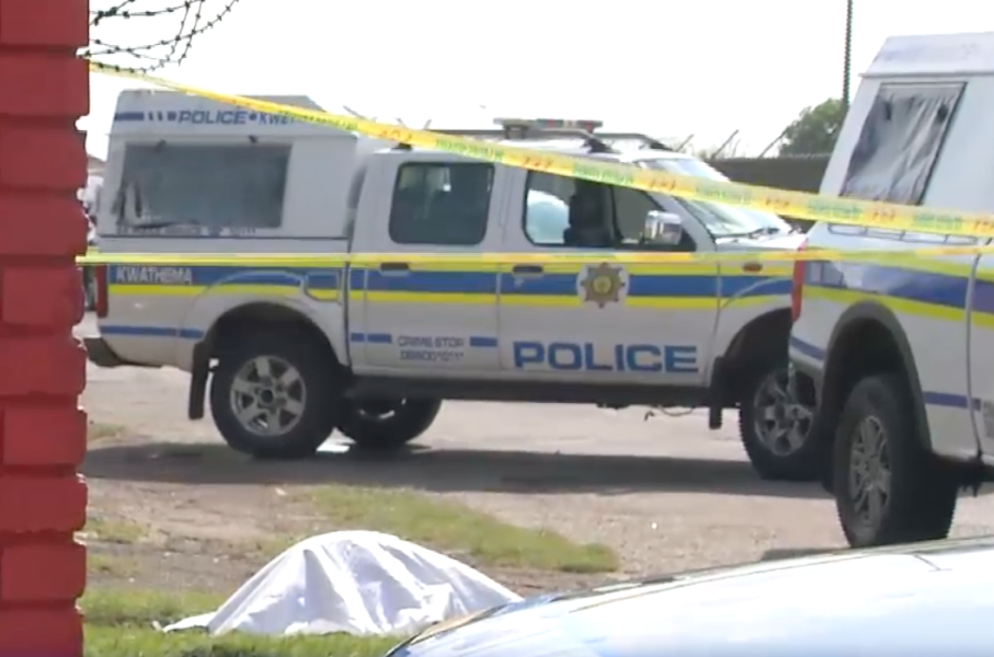 SAPS vehicles at a crime scene