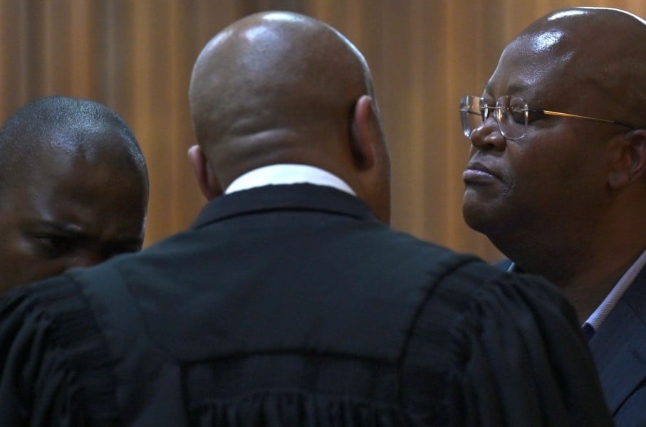Shaun Abrahams speaks with his two clients Kabelo John Matsepe and Mamone Daniel Msiza at the Pretoria High Court. Gallo Images/Beeld/Deaan Vivier