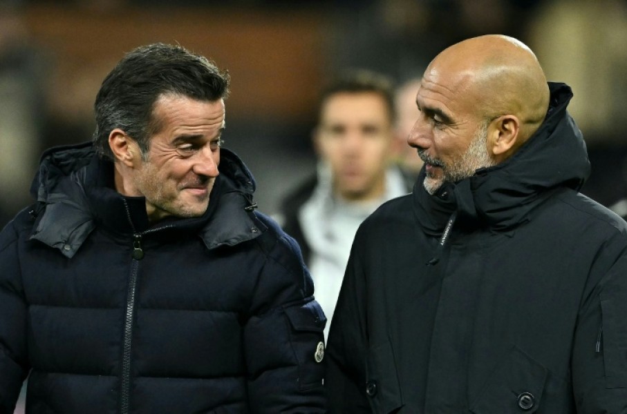 Fulham manager Marco Silva (left) speaks with Manchester City boss Pep Guardiola at Craven Cottage
