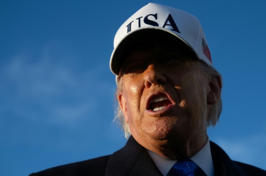 US President Donald Trump speaks to reporters before boarding Air Force One as he departs Joint Base Andrews in Maryland on March 13, 2026