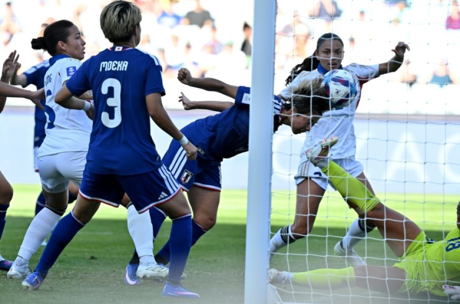 Mina Tanaka (C) scored Japan's opening goal in theirWomen's Asian Cup quarter-final with the Philippines