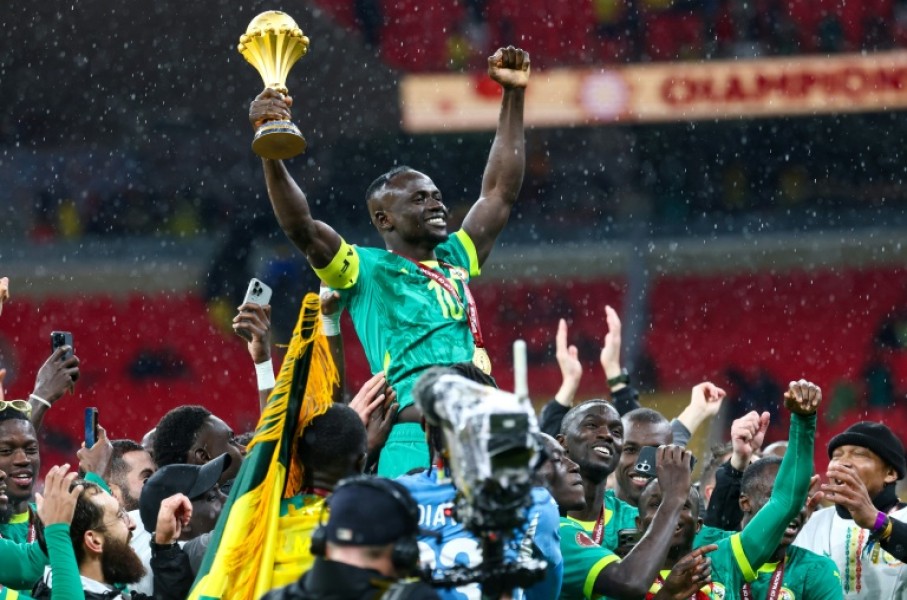Senegal's forward Sadio Mane celebrates with the trophy after winning the Africa Cup of Nations final football match against Morocco in January 2026