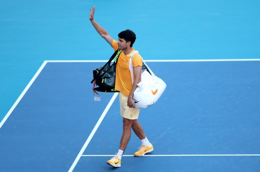 Early exit: World number one Carlos Alcaraz waves to fans after falling to 36th-ranked Sebastian Korda in the third round of the Miami Open