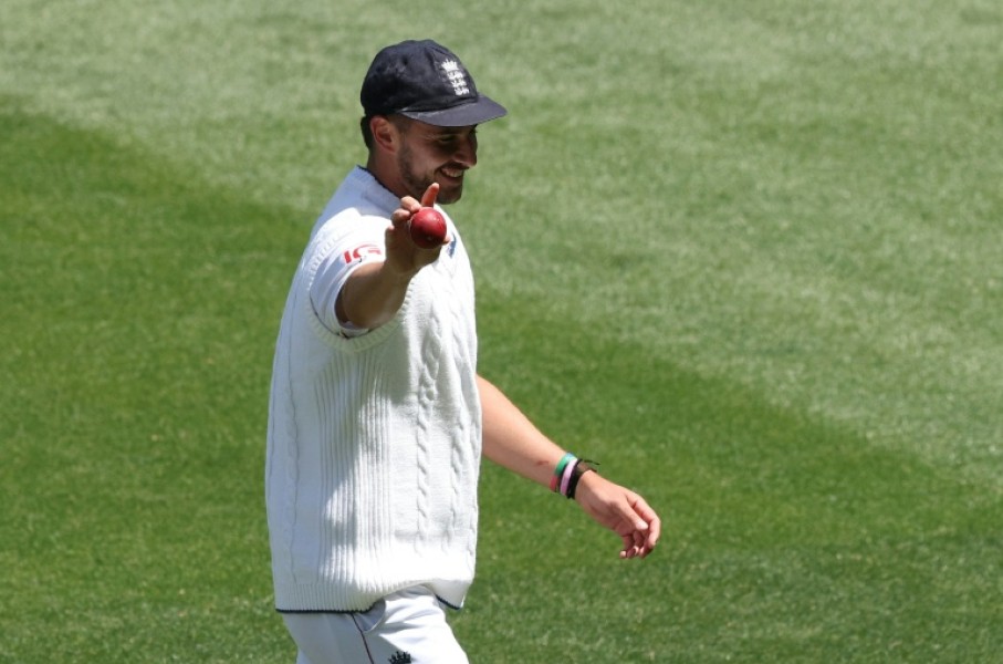 England's Josh Tongue holds the ball up after taking five wickets during the first day of the fourth Ashes Test against Australia at the Melbourne Cricket Ground (MCG) in December