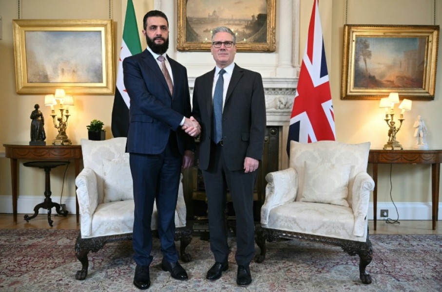 Syria's President Ahmed al-Sharaa is welcomed by Britain's Prime Minister Keir Starmer for talks at 10 Downing Street in central London