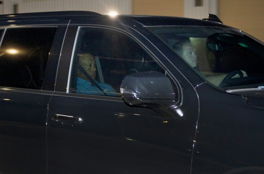 Tiger Woods is driven from the Martin County Jail after being arrested for driving under the influence after a car crash