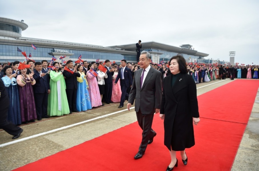 Chinese Foreign Minister Wang Yi (C) is welcomed by North Korean Foreign Minister Choe Son-hui (R) upon arriving on a two-day visit at Pyongyang International Airport on April 9, 2026.
