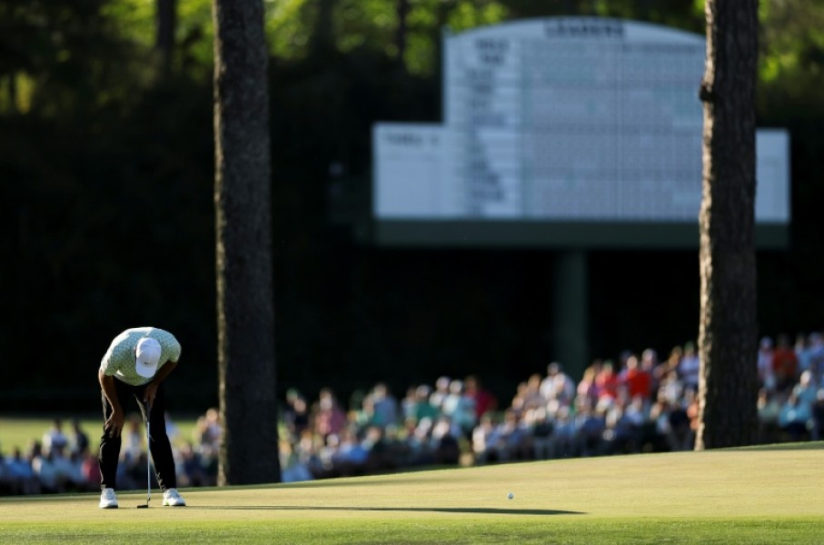 World number one Scottie Scheffler reacts after a missed putt on the 15th green during the first round of the 90th Masters