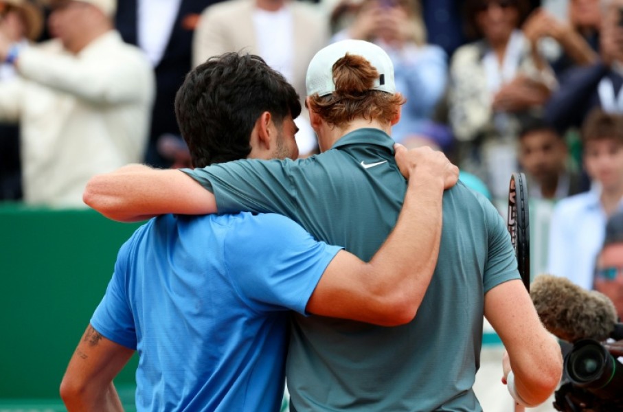 Spain's Carlos Alcaraz (L) lost the world number one spot to great rival Jannik Sinner (R) after the Italian beat him in the final of the Monte Carlo Masters
