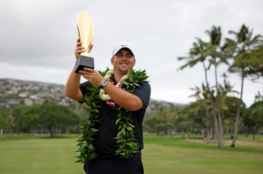 Chris Gotterup celebrates with the trophy after winning this year's Sony Open. The PGA Tour is now scrapping its season-opening swing in Hawaii