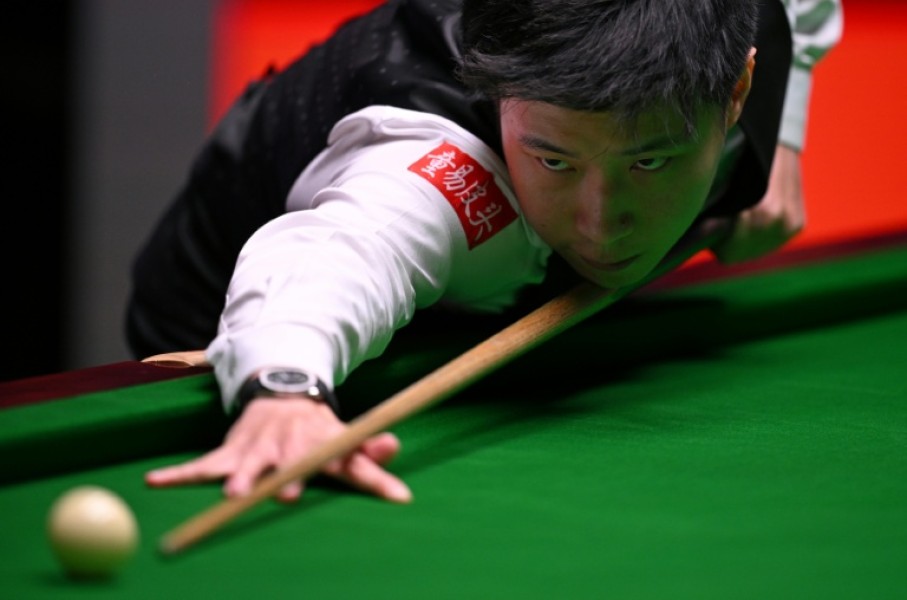 Reigning champion Zhao Xintong of China has been knocked out of the World Snooker Championship by Shaun Murphy