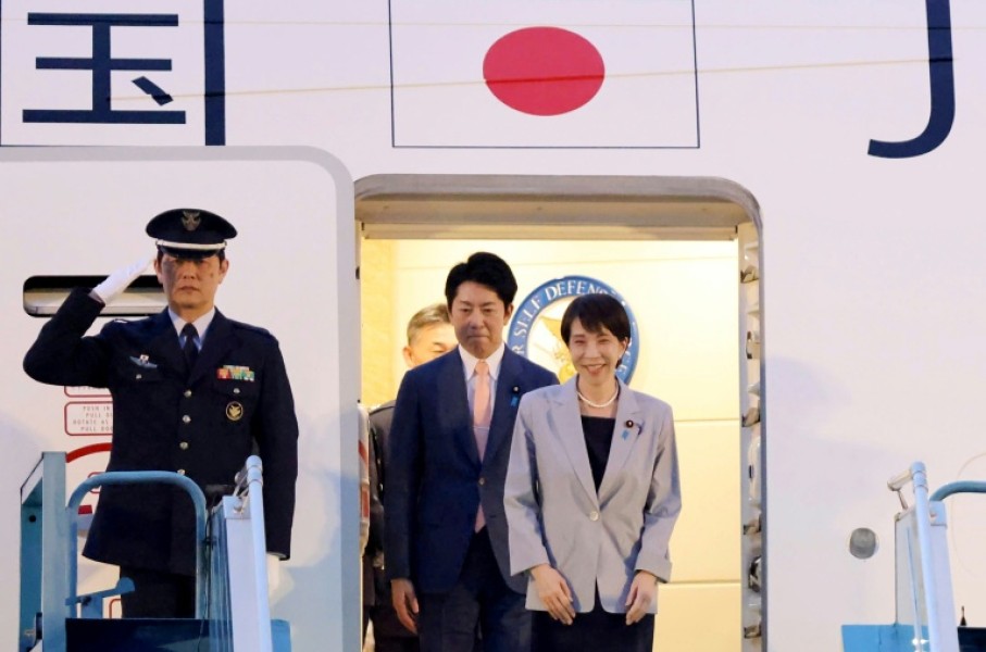 Japan's Prime Minister Sanae Takaichi (R) disembarks a plane upon arrival at Noi Bai International Airport in Hanoi on May 1, 2026.