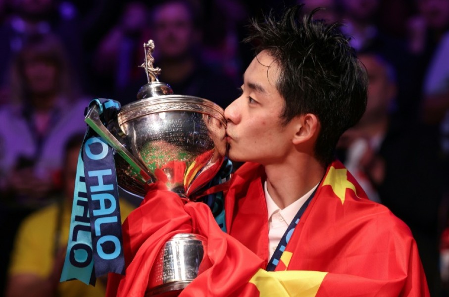 China's Wu Yize celebrates winning the World Snooker Championship