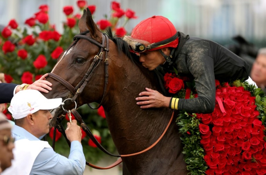 Jockey Jose Ortiz celebrates his Kentucky Derby victory aboard Golden Tempo