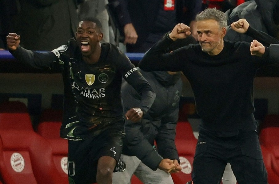 PSG coach Luis Enrique (R) and Ousmane Dembele begin the celebrations after holding off Bayern Munich to reach another Champions League final