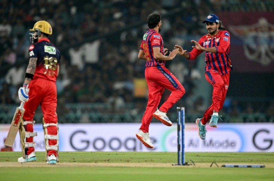 Prince Yadav (C) celebrates with Lucknow Super Giants team-mate Digvesh Rathi after dismissing Virat Kohli (L)
