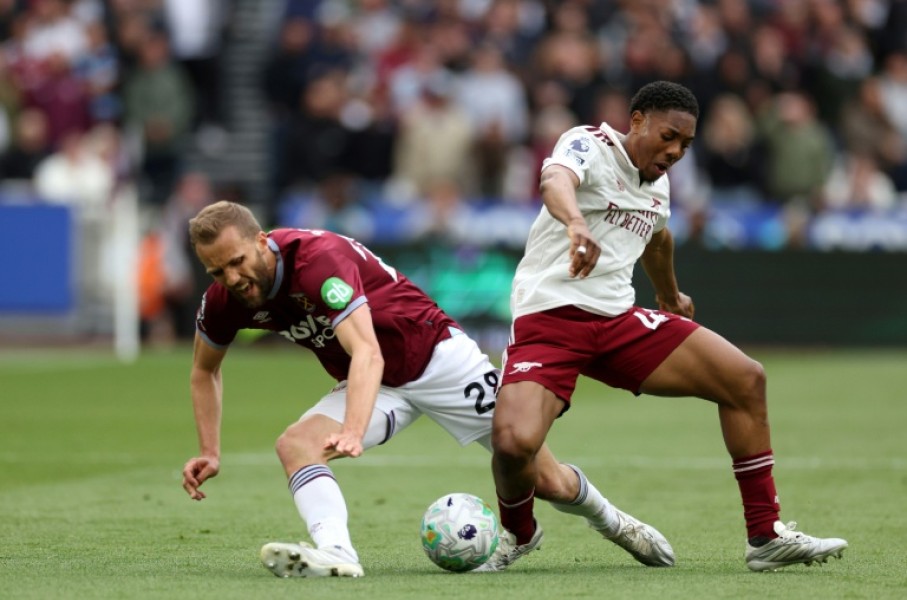 Arsenal's Myles Lewis-Skelly (R) tackles West Ham's Tomas Soucek (L) during the Gunners' 1-0 Premier League win at the London Stadium