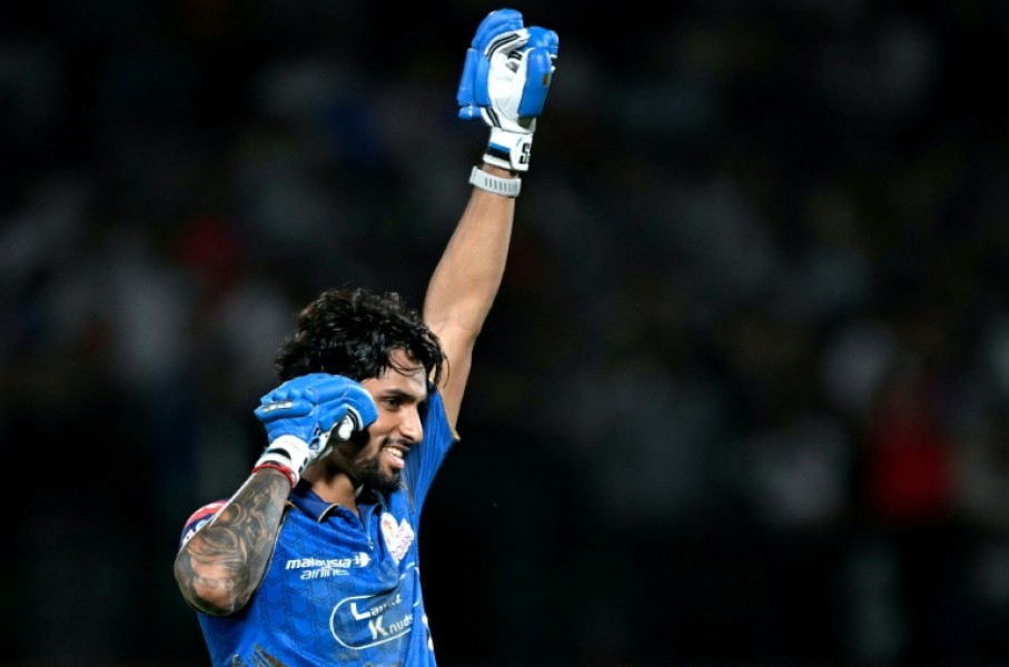 Tilak Varma celebrates after powering Mumbai Indians to victory over Punjab Kings.