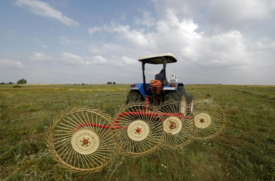 A farmer uses a hay-collecting machine in a field in the Zehiliga region of Morocco. Rising fertiliser costs are threatening the livelihoods of many farmers