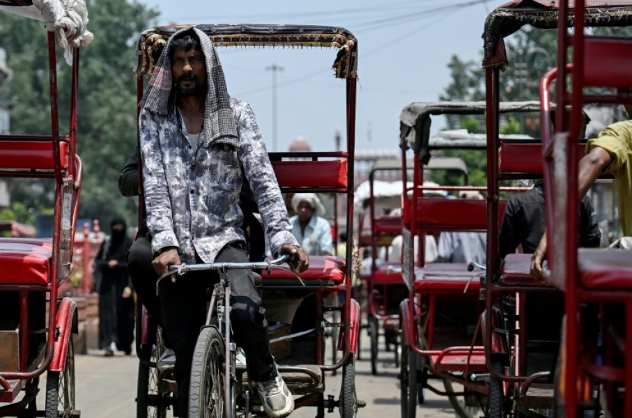 A rickshaw puller in Delhi, where temperatures hit 45C on Thursday. The South Asian country of 1.4 billion people is no stranger to scorching summers, with routine heatwaves between April and June