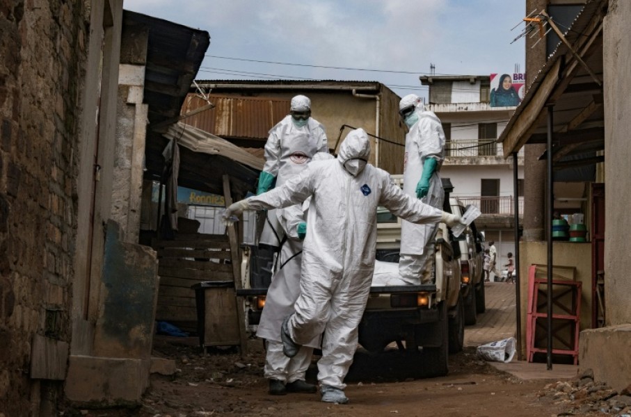 A Ugandan Red Cross worker during the evacuation of the body of a suspected Ebola victim in Kampala on May 26