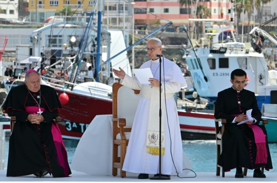 Pope Leo XIV delivers a speech during a meeting with organizations working with migrants in the port of Arguineguin on the Canary Island of Gran Canaria, a place accustomed to the arrival of migrants