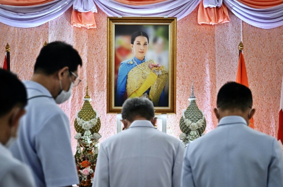 Well-wishers bow in front of an image of Thailand's Princess Bajrakitiyabha Mahidol, at Chulalongkorn Hospital in Bangkok
