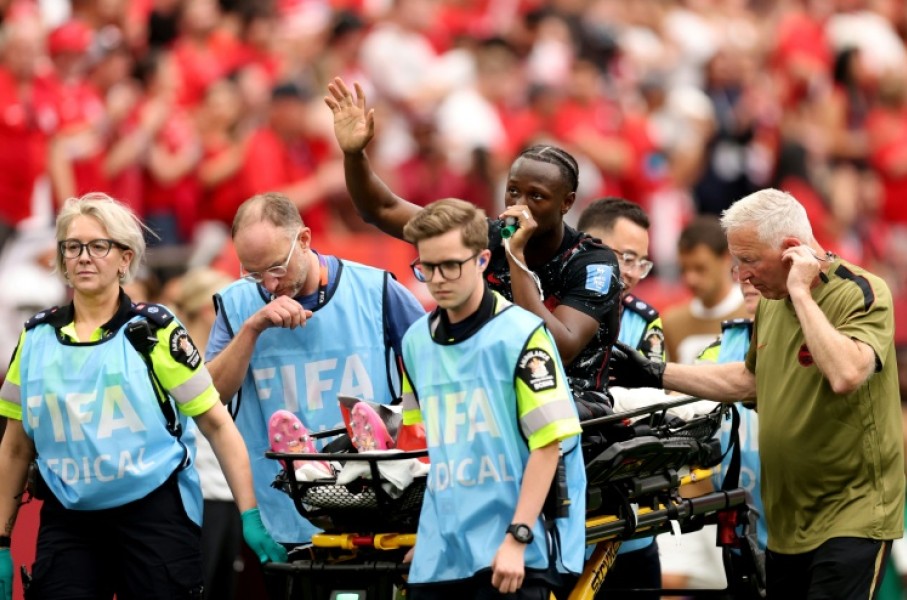 Canada's Ismael Kone waves to the crowd after suffering a serious injury in the 6-0 win over Qatar