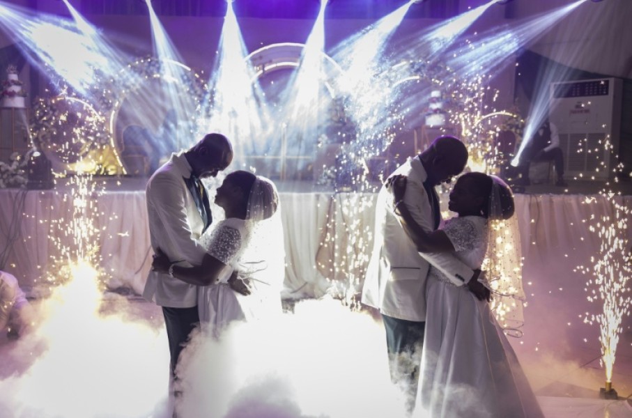 Twin brothers Taiwo and Kehinde Oguntoye dance with twin sisters Taiwo and Kehinde Adediran at their double wedding reception